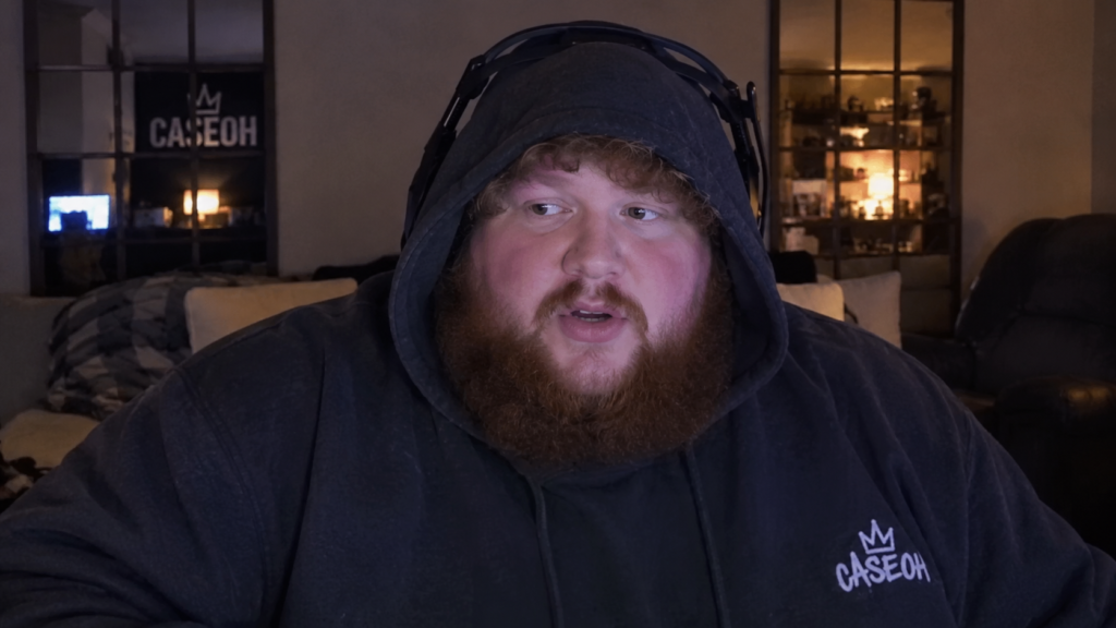 CaseOh wearing a black hoodie and headphones during a livestream