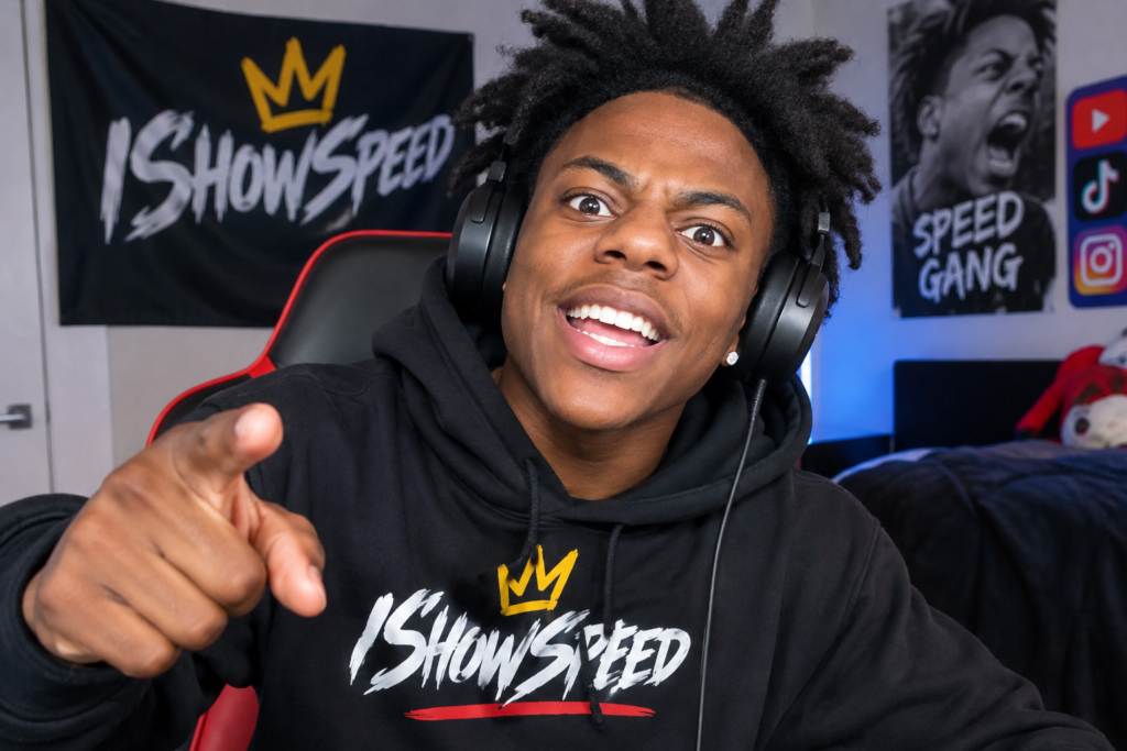 IShowSpeed wearing headphones and a black hoodie while streaming in a gaming setup